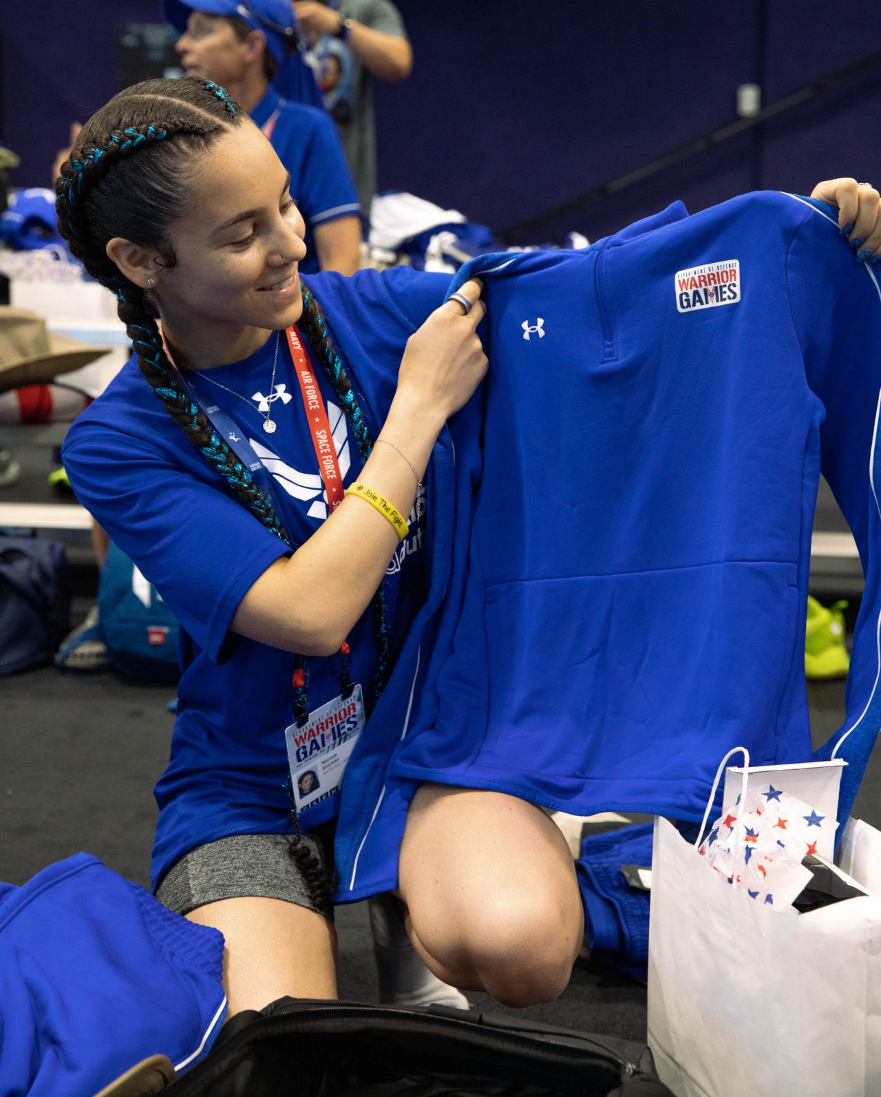 Girl holding up a shirt