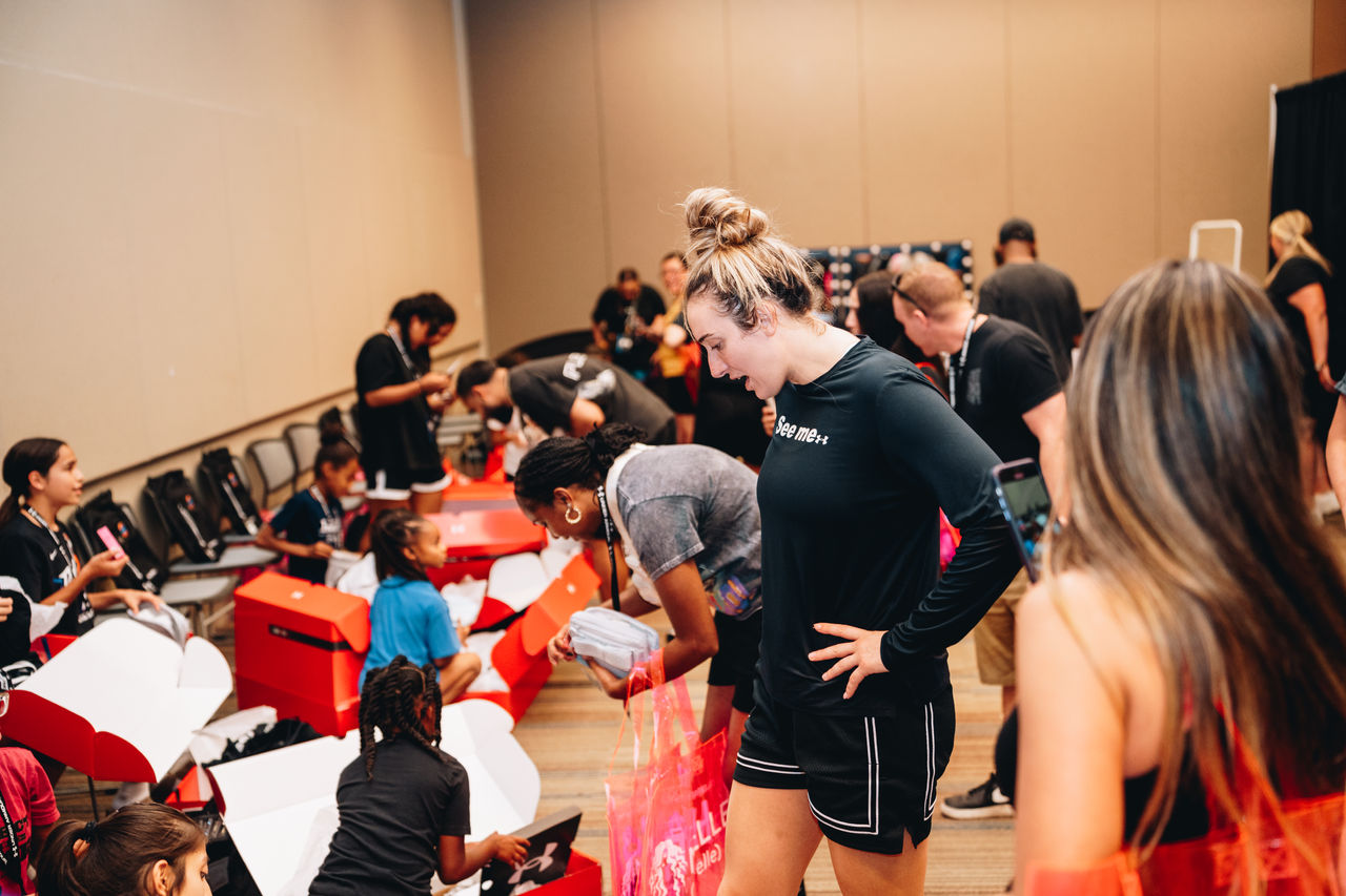 girls in a room opening up boxes of new stuff