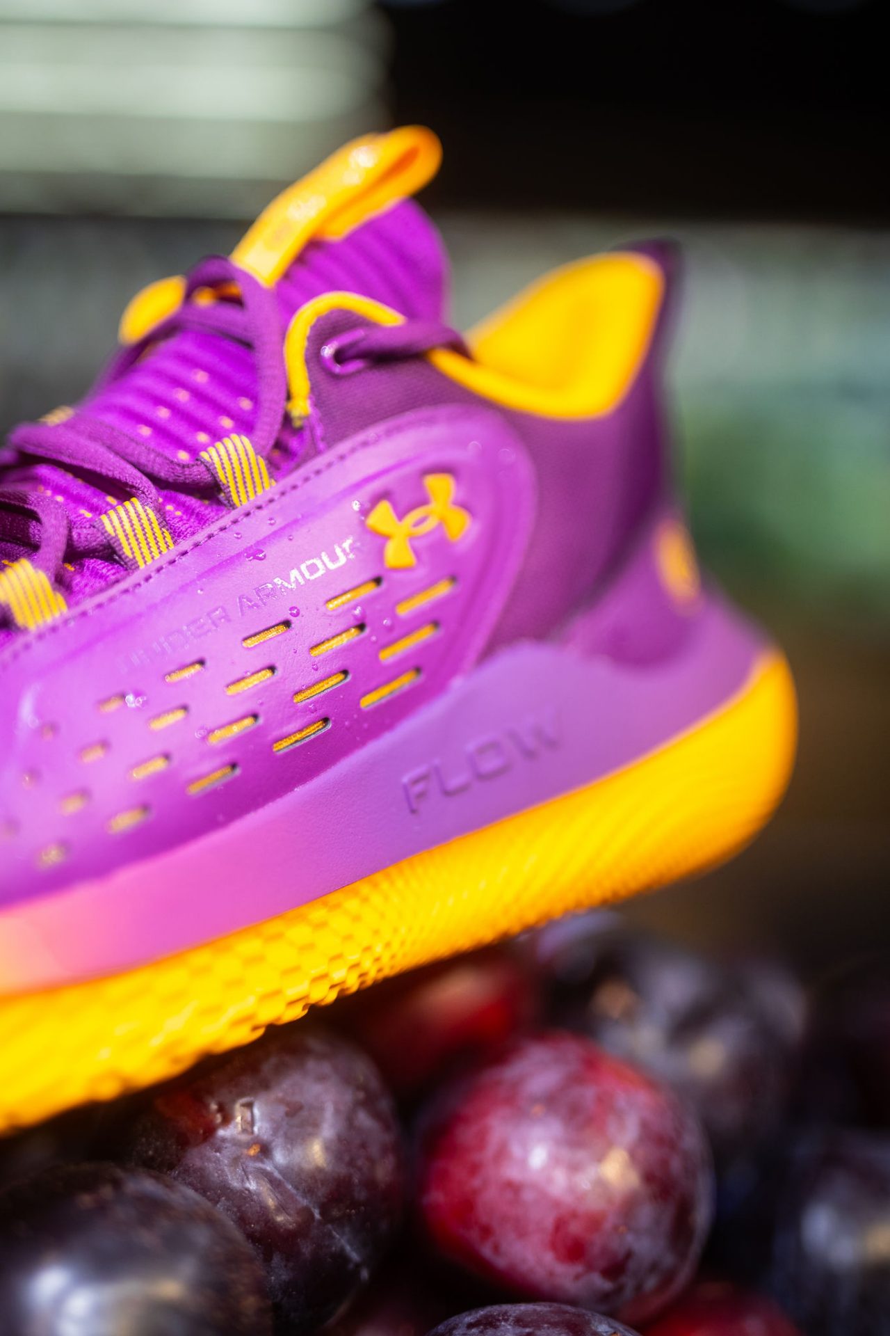 Plum sneakers on a pile of plums