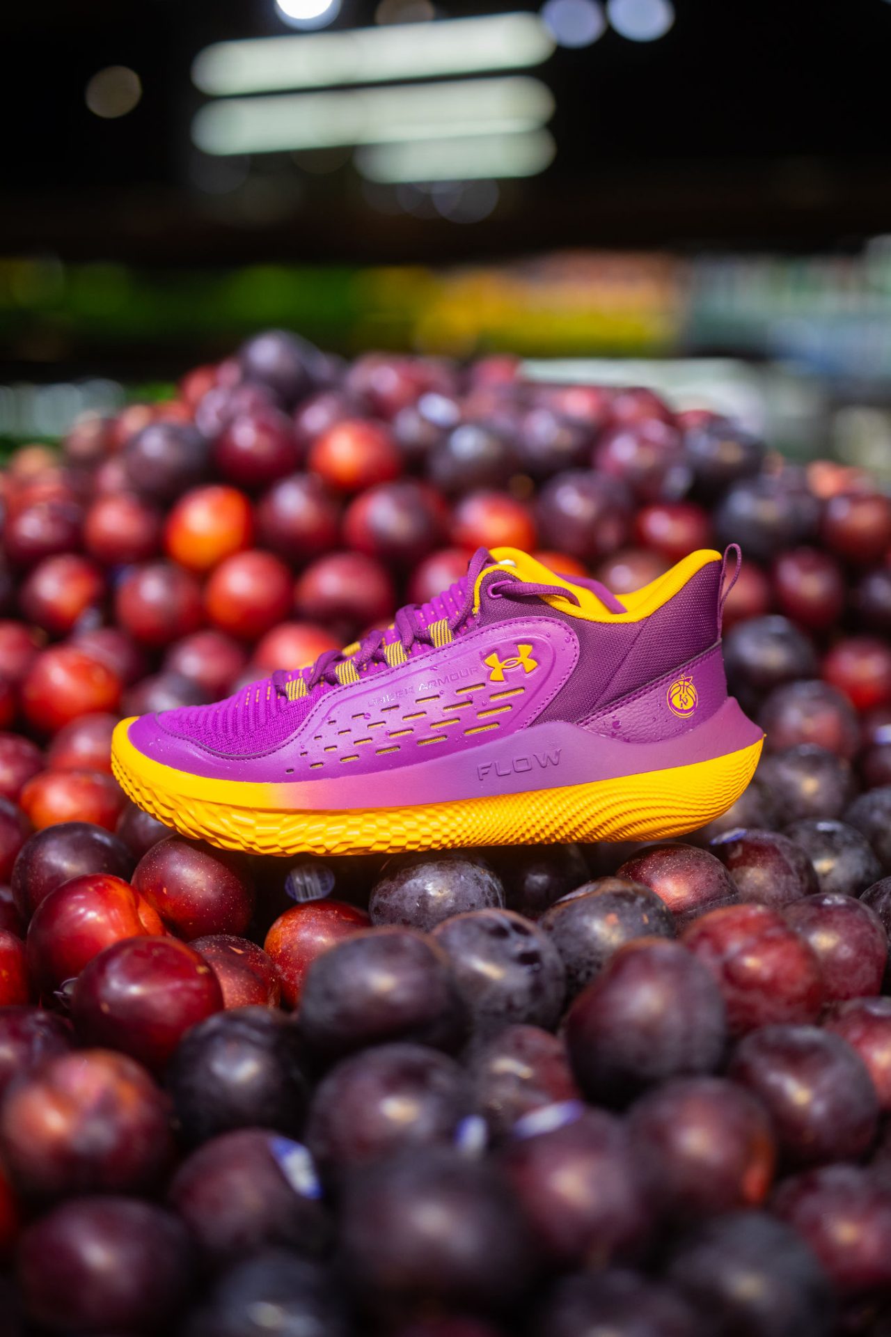 purple sneaker on a pile of plums