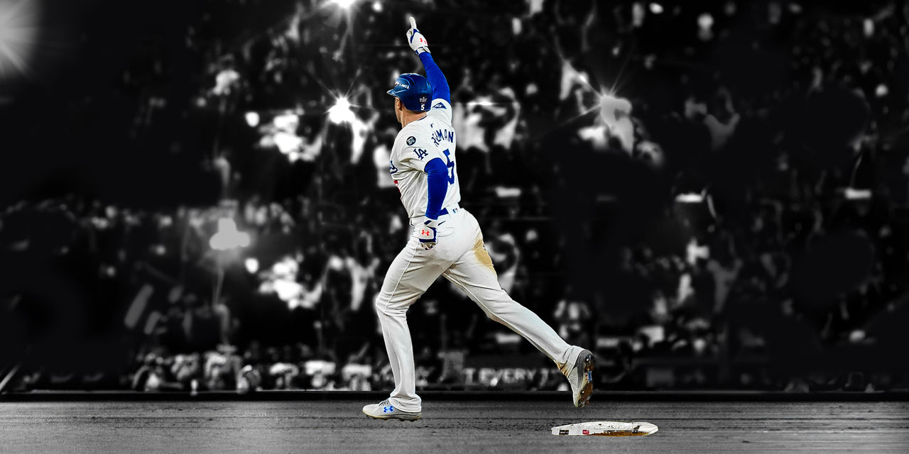 Freddie Freeman running base with finger pointed to the sky