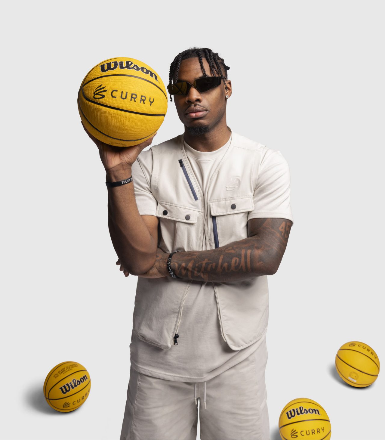 Davion Mitchell holding a basketball
